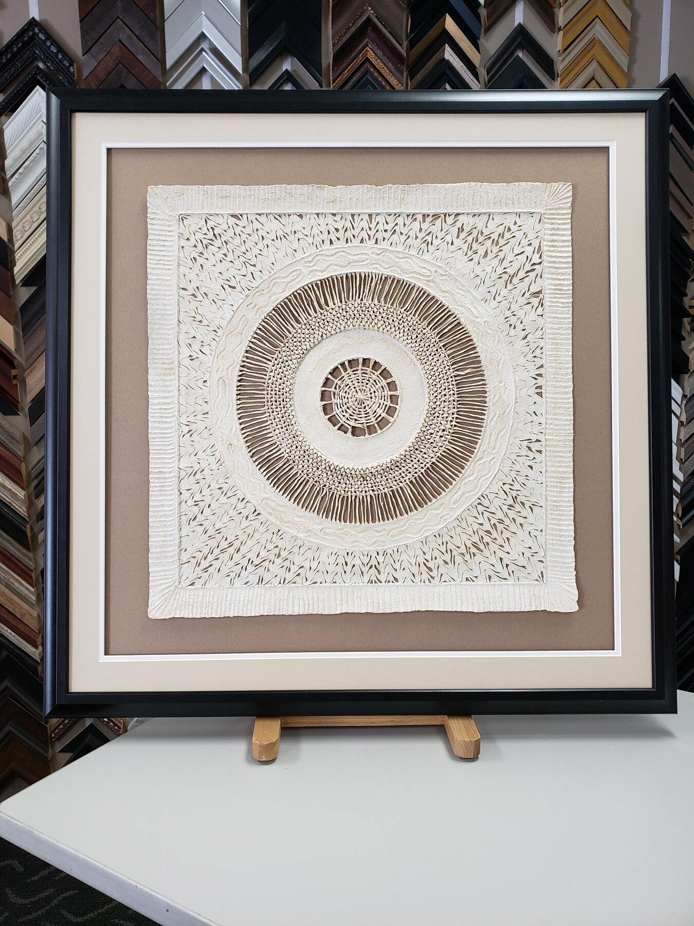 Full project view of handcrafted textile art frame custom framing project