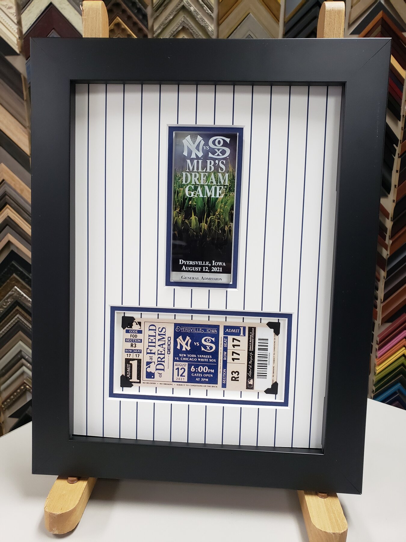 Full project view of motorsport event keepsake custom framing project
